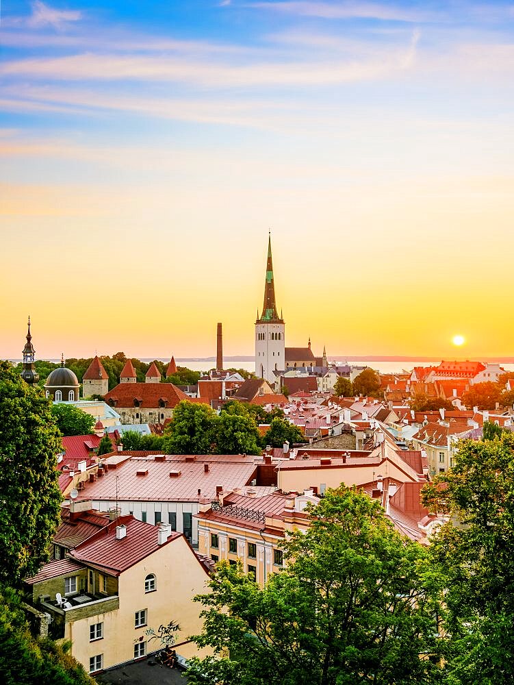 View over the Old Town towards St Olaf's Church at sunrise, Tallinn, Estonia