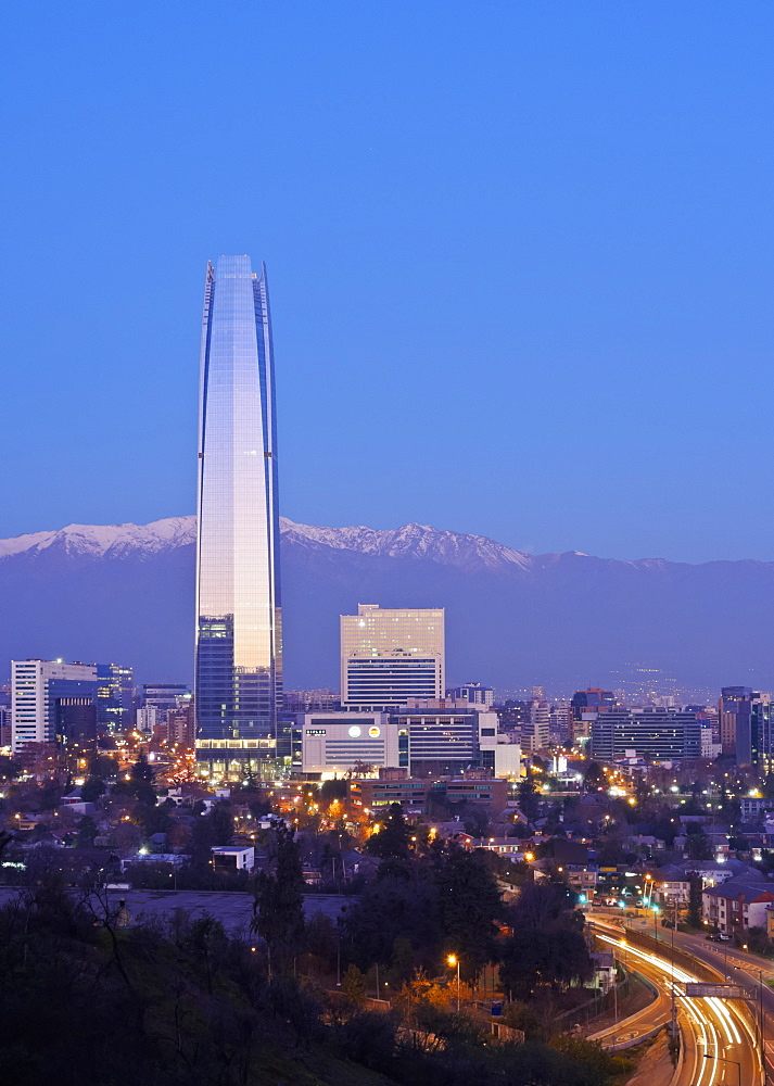 Twilight view from the Parque Metropolitano towards the high raised buildings with Costanera Center Tower, Santiago, Chile, South America