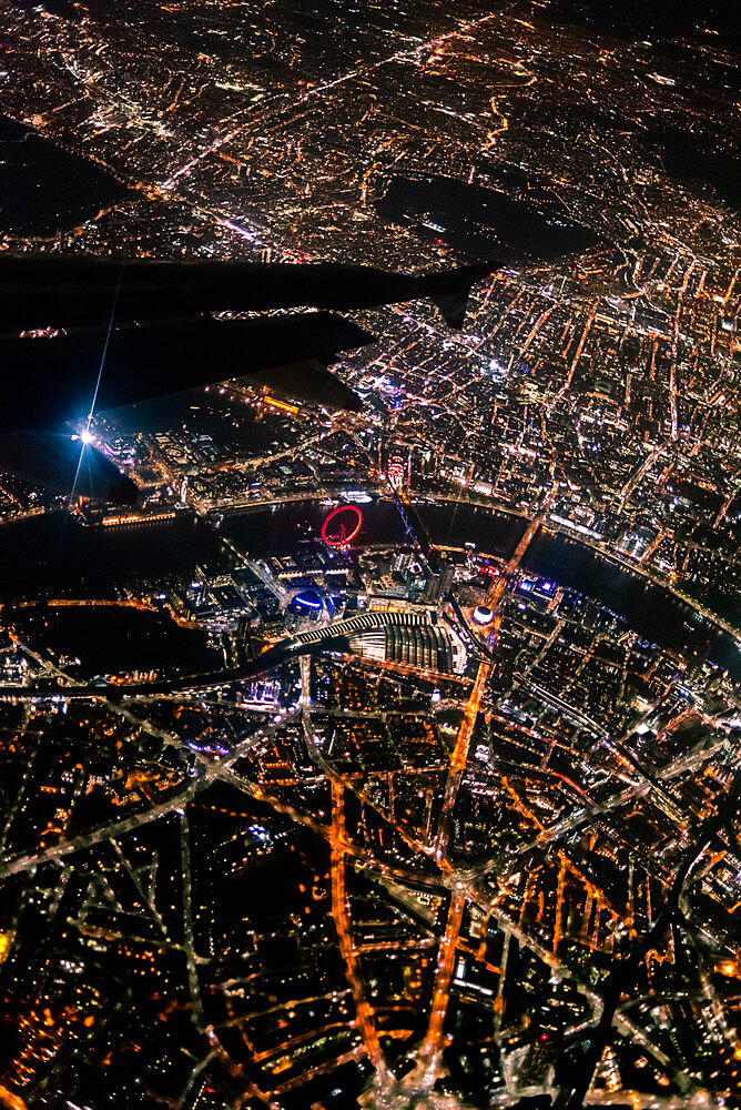 View over London at night from an airplane window, London, England, United Kingdom, Europe