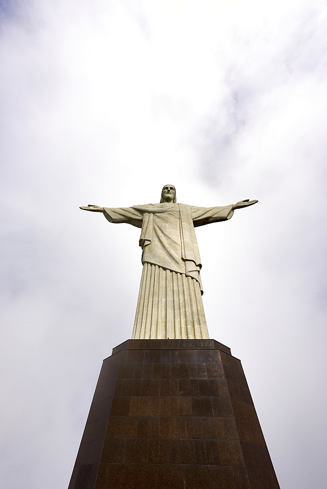 Low angle shot of the iconic statue of Christ the Redeemer on a cloudy day, Rio de Janeiro, Brazil, South America