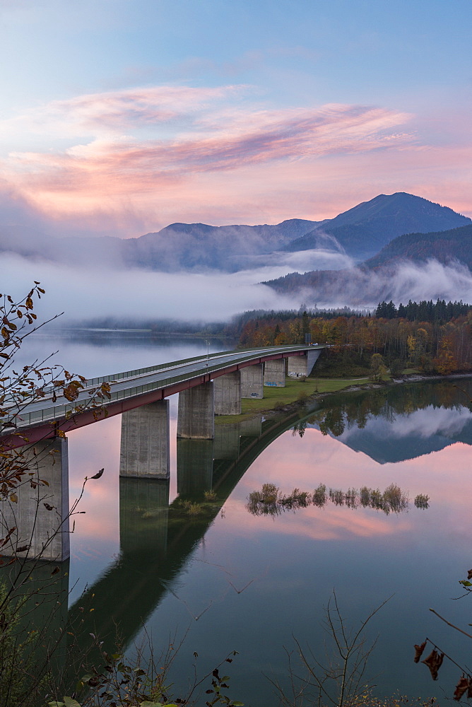 Sylvenstein Lake and bridge surrounded by the morning mist at dawn, Bad Tolz-Wolfratshausen district, Bavaria, Germany, Europe