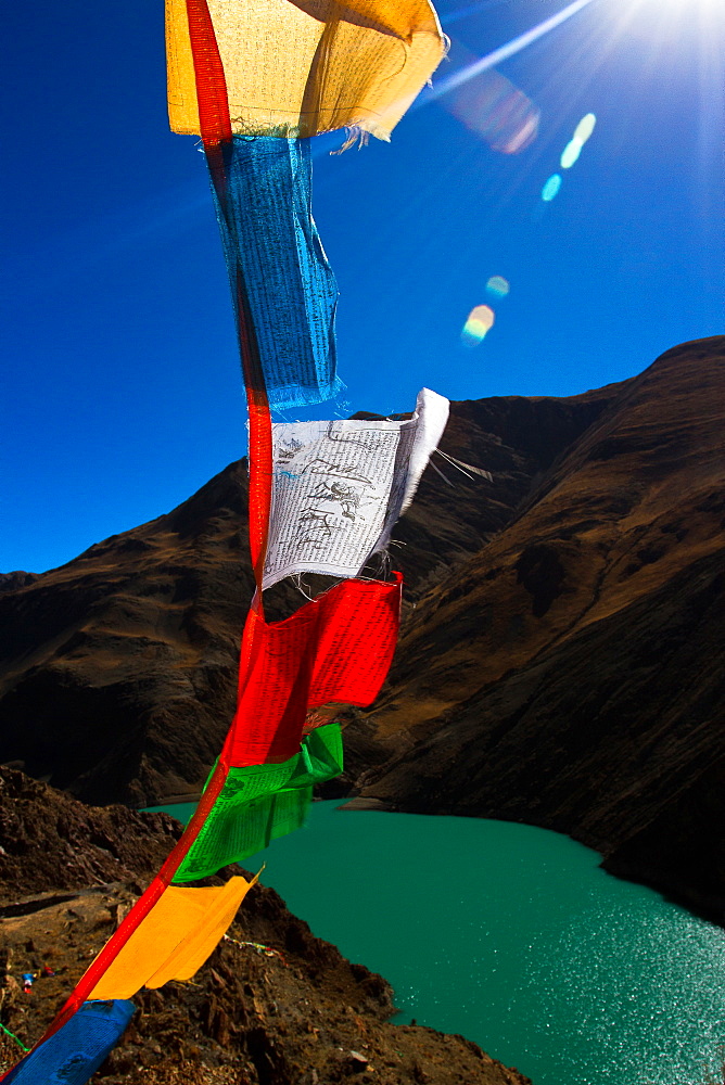 The Yamdrok Lake of Tibet with prayer flags, Tibet, China, Asia