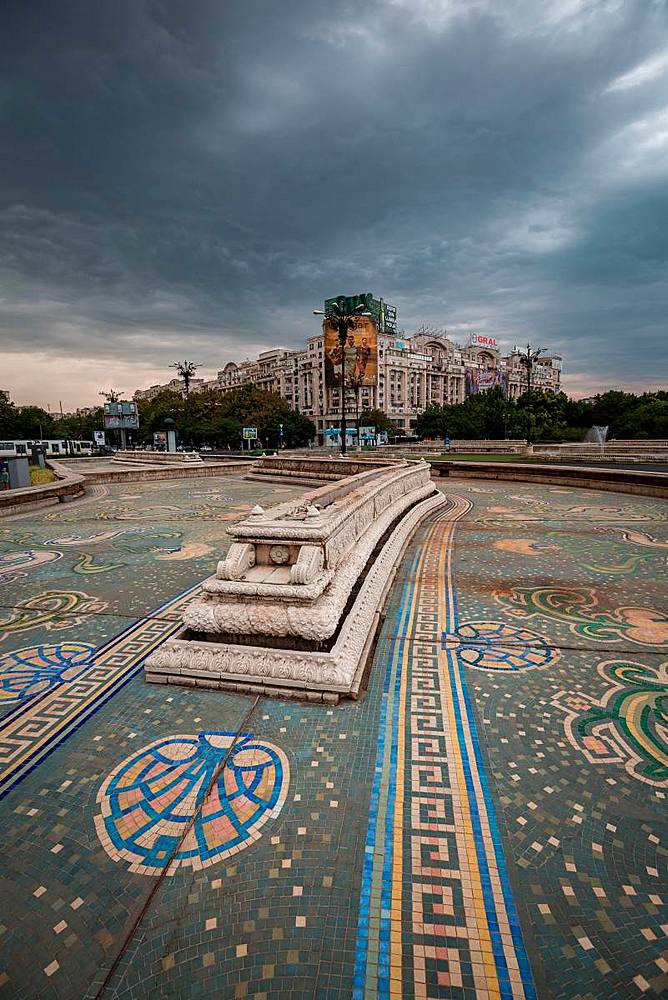 An empty fountain and impending storm in Bucharest, Romania, Europe