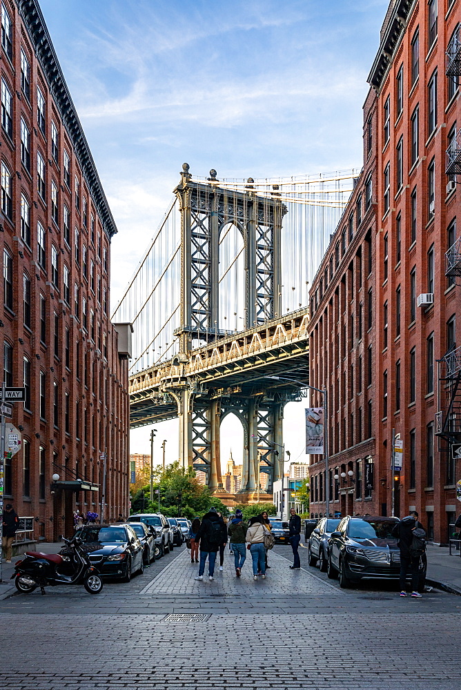 Manhattan Bridge with the Empire State Building through the Arches, seen from Washington Street in Brooklyn, New York, United States of America, North America