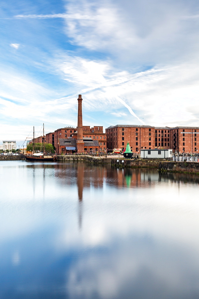 The Pump House pub and Albert Dock buildings reflected in a still Canning Dock. Liverpool, Merseyside, England, United Kingdom, Europe