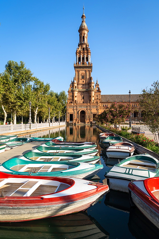 Passenger boats in front of the North Tower of Plaza de Espana, Parque de Maria Luisa, Seville, Andalusia, Spain, Europe