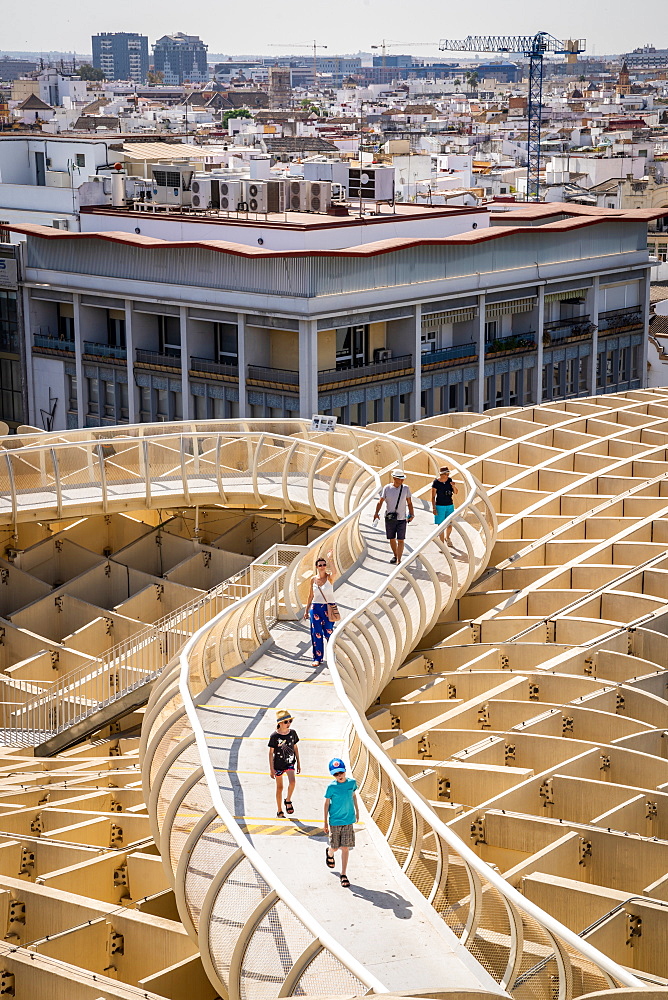 People on the elevated walking platform of Seville's Metropol Parasol, La Encarnacion Square, Seville, Andalusia, Spain, Europe