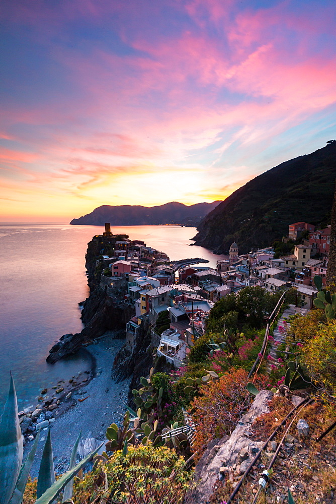 A stunning sunset over the old town and harbour of Vernazza, Cinque Terre, UNESCO World Heritage Site, Liguria, Italy, Europe