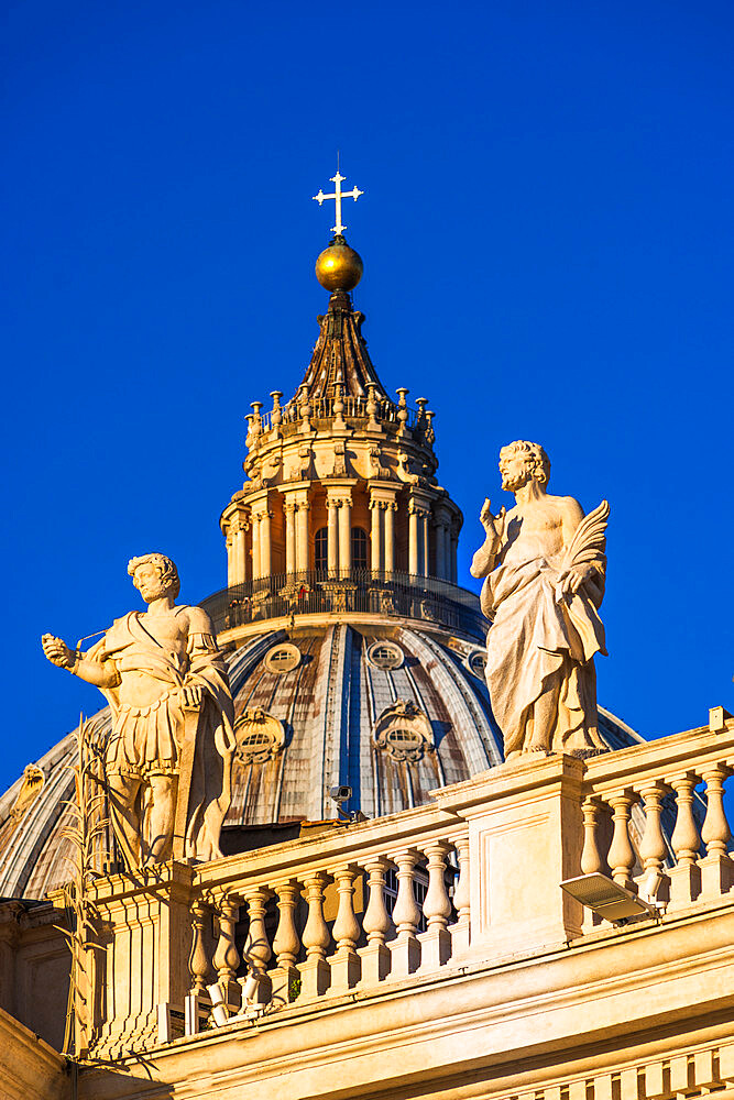 St. Peter's Basilica Cupola and statues in early morning light, Vatican City, UNESCO World Heritage Site, Rome, Lazio, Italy, Europe