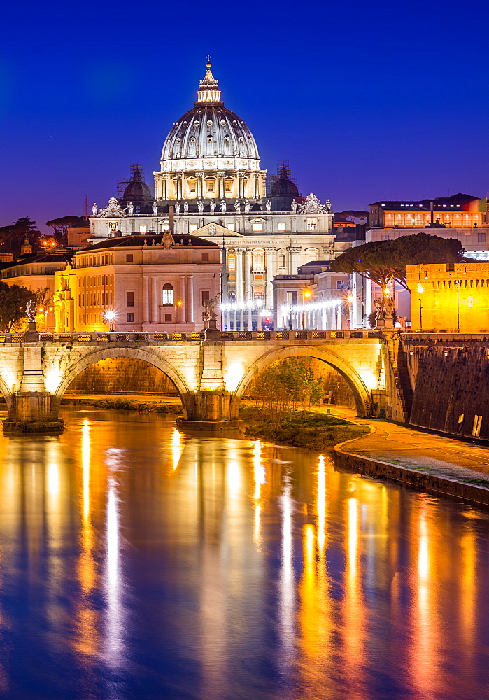 St. Peter's Basilica in Vatican City lit up after dark and Tiber River, Rome, Lazio, Italy, Europe