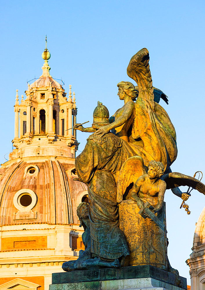 Bronze sculpture at the entrance to Monumento Nazionale a Vittorio Emanuele II with the Church of Santa Maria di Loreto, Rome, Lazio, Italy, Europe