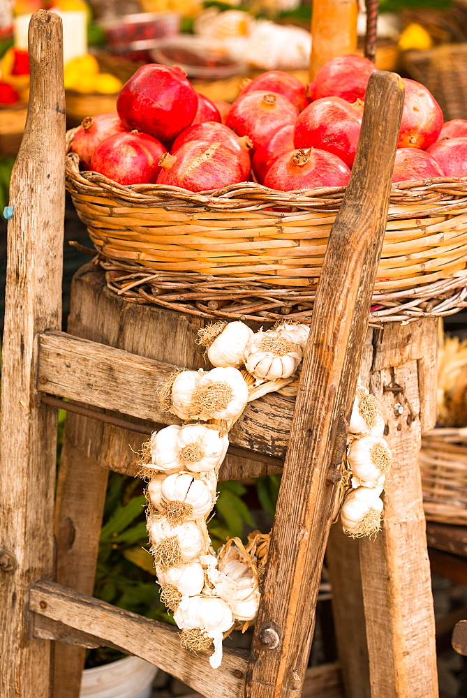 Pomegranates and garlic on display at Campo de Fiori Market, Rome, Lazio, Italy, Europe