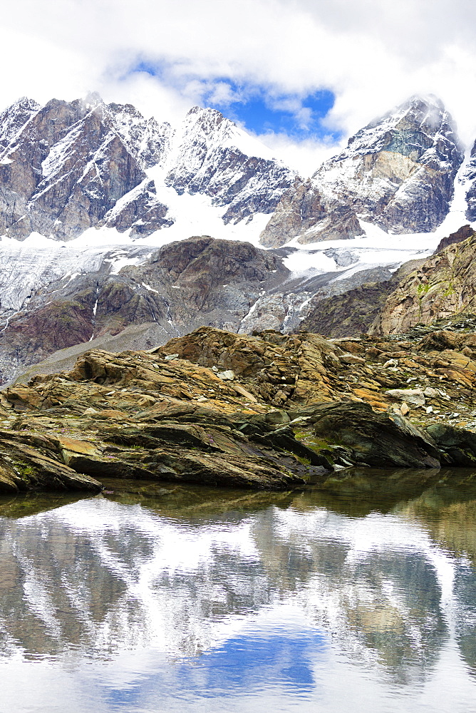 Pizzo Bernina reflected in the Forbici Lake, Valmalenco, Valtellina, Lombardy, Italy, Europe