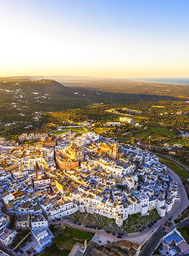 Aerial view of the old town of Ostuni at sunset, Apulia, Italy, Europe