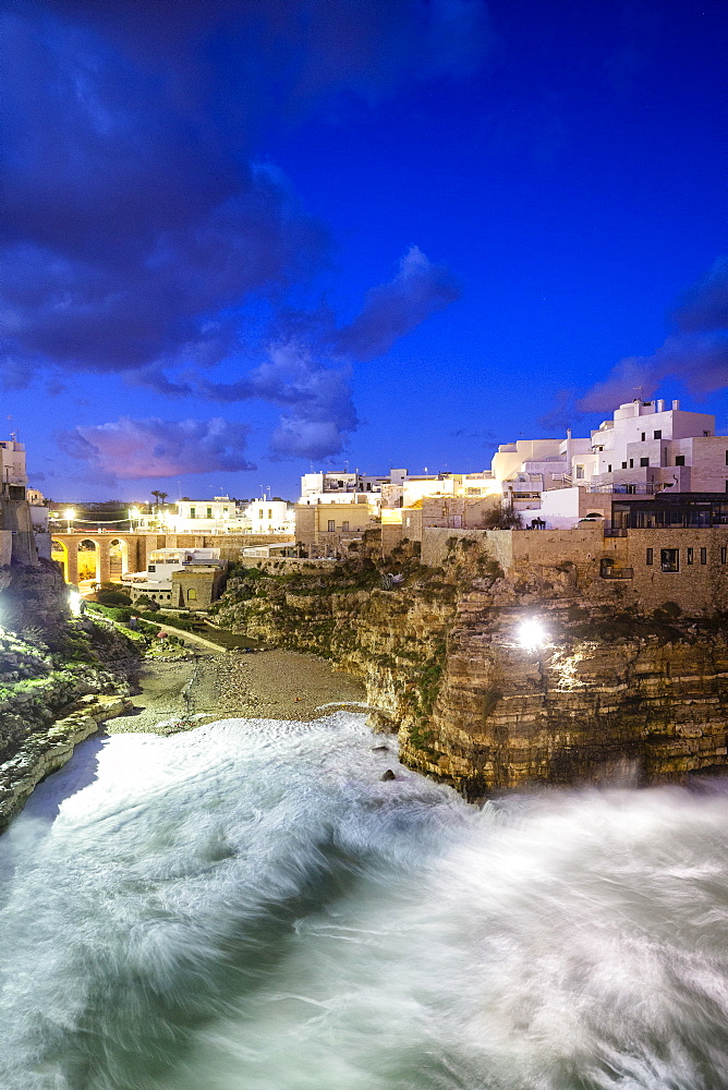 Waves crash on the beach during a winter storm, Polignano a Mare, Apulia, Italy, Europe