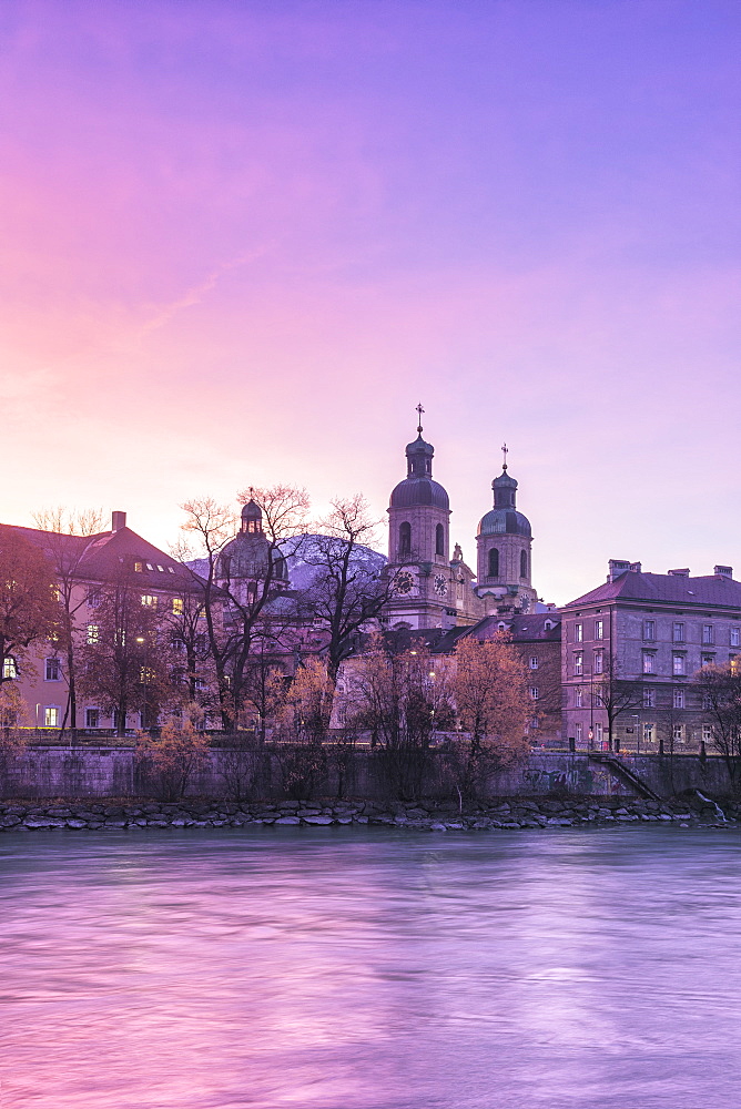 Cathedral of St. James is reflected in Inn River at sunrise, Innsbruck, Tyrol, Austria, Europe