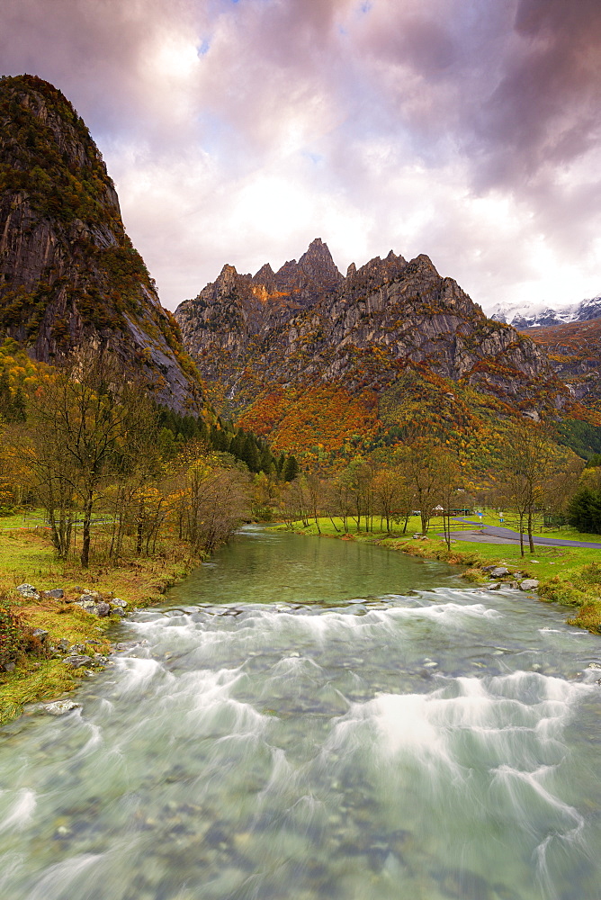 Torrent surmounted by mountains at sunrise, Valmasino, Valtellina, Lombardy, Italy, Europe