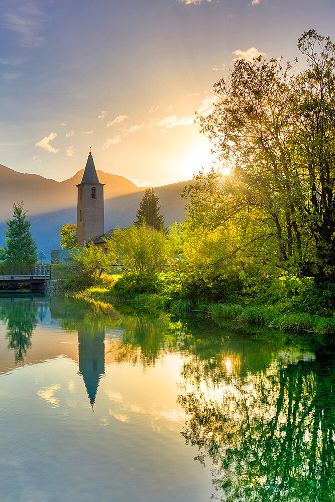 Traditional church of Sils facing Inn River at sunrise, Sils Maria, Engadine valley, Graubunden, Switzerland, Europe