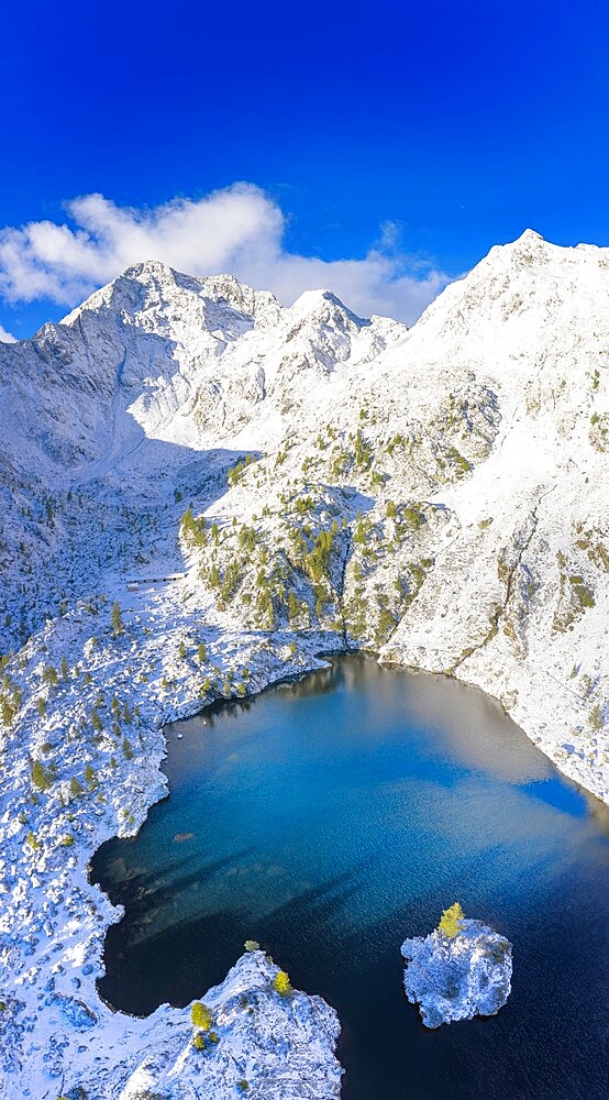 Aerial view of Lago Nero after a summer snowfall, Val Belviso, Valtellina, Orobie Alps, Lombardy, Italy, Europe