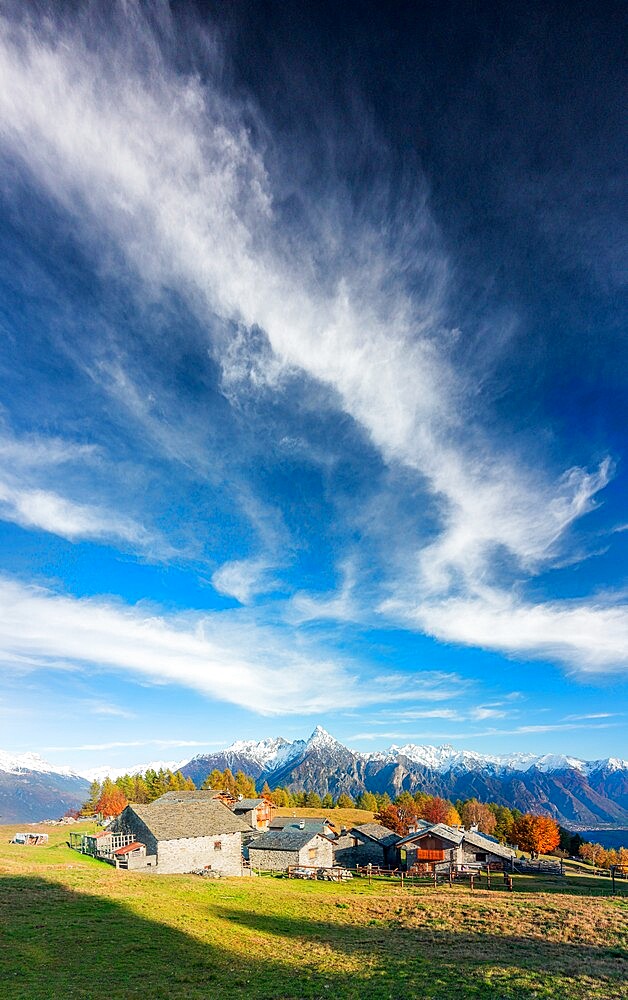 Amazing clouds above the traditional mountain village, Valchiavenna, Lombardy, Italy, Europe