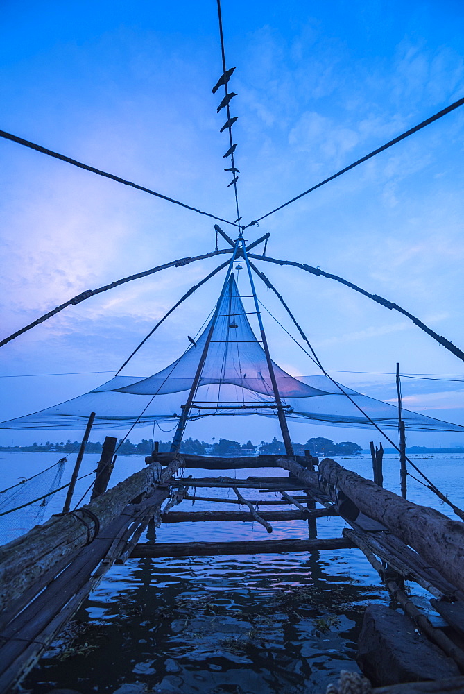 Traditional Chinese fishing nets at dawn, Fort Kochi (Cochin), Kerala, India, Asia