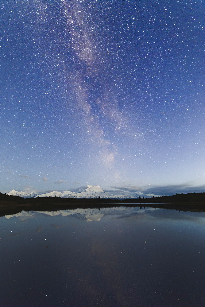 Milky way rises above Mount Denali (Mount McKinley), viewed from the Reflection Pond, Alaska, United States of America, North America