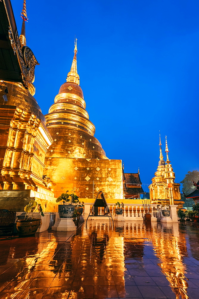 Lightning and thunderstorm over Wat Phra Singh Gold Temple at night, Chiang Mai, Thailand, Southeast Asia, Asia