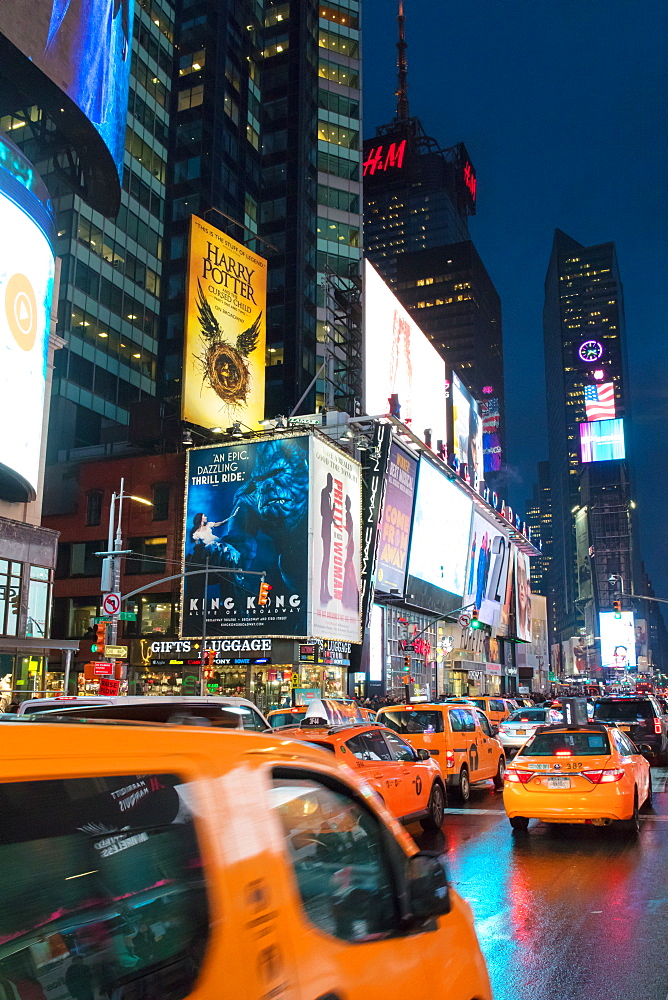 Yellow taxis in Times Square at night. New York City, New York, United States of America, North America