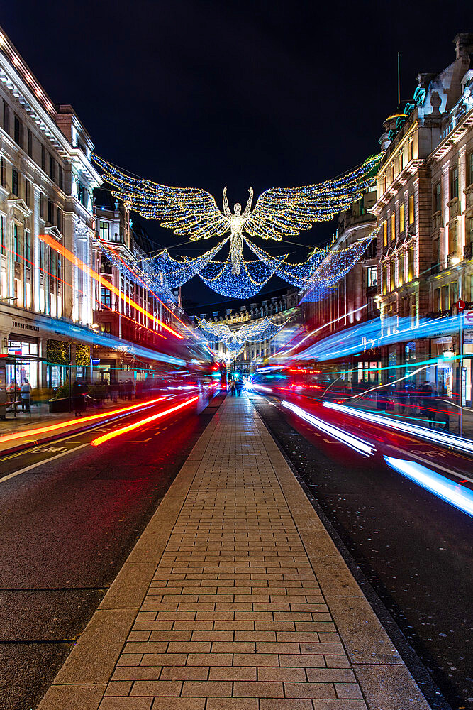 Christmas decorations in Regent Street with light trails, London, England, United Kingdom, Europe