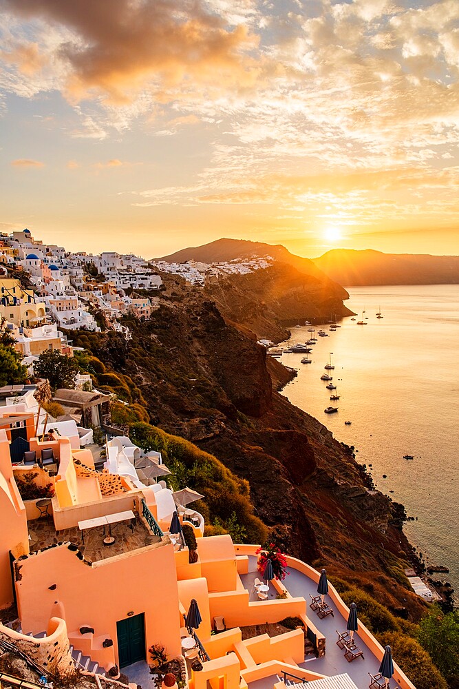 Sunrise over coastline of Oia, Santorini, Cyclades, Greek Islands, Greece, Europe