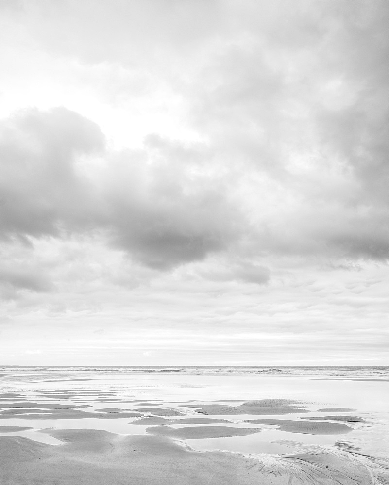 Cloud formations and wet sand on the vast expanse of beach at Sandymouth, Bude, Cornwall, England, United Kingdom, Europe