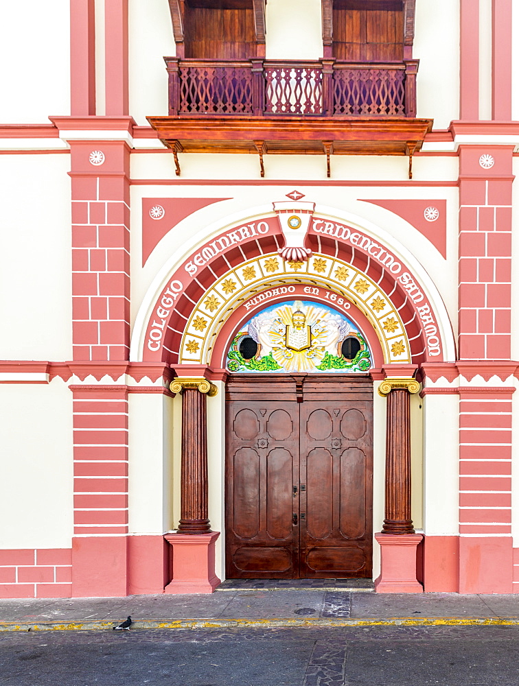 The colourful Renaissance influenced facade of the College of San Ramon by Central Park, Leon, Nicaragua, Central America