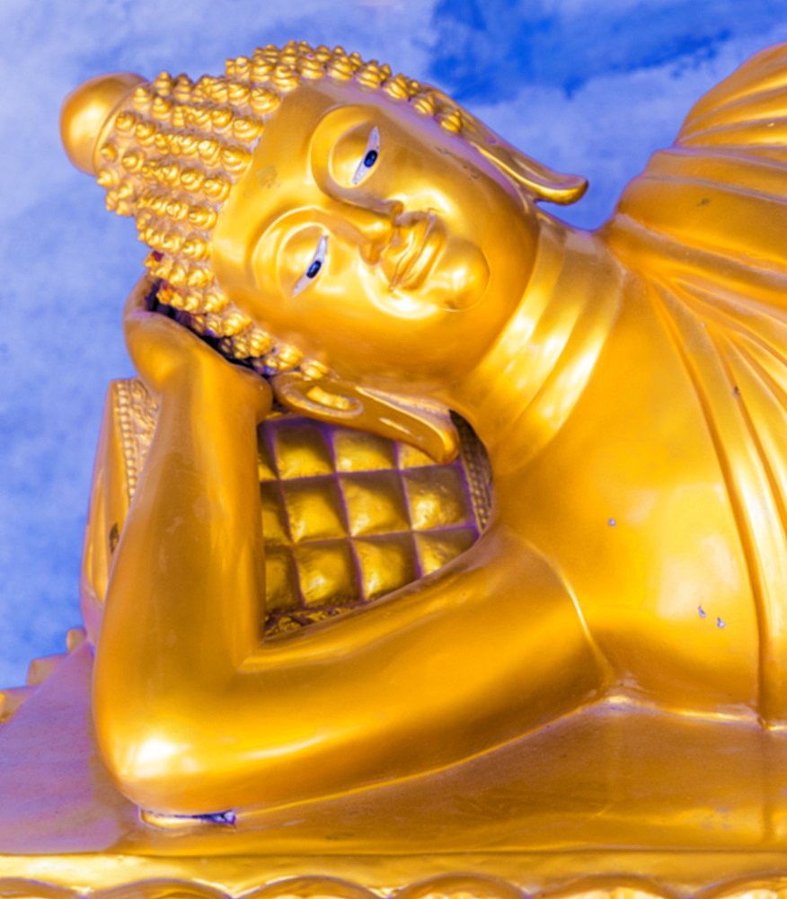 A gold Buddha in saiyat posture at the Big Buddha complex (The Great Buddha) in Phuket, Thailand, Southeast Asia, Asia