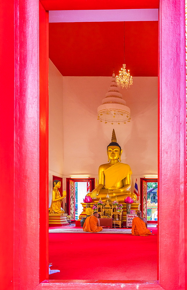 Monks in Mongkol Nimit temple (Wat) in Phuket old town, Phuket, Thailand, Southeast Asia, Asia