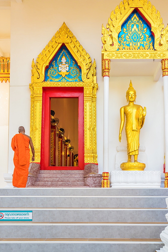 A monk at Mongkol Nimit temple (Wat) in Phuket old town, Phuket, Thailand, Southeast Asia, Asia