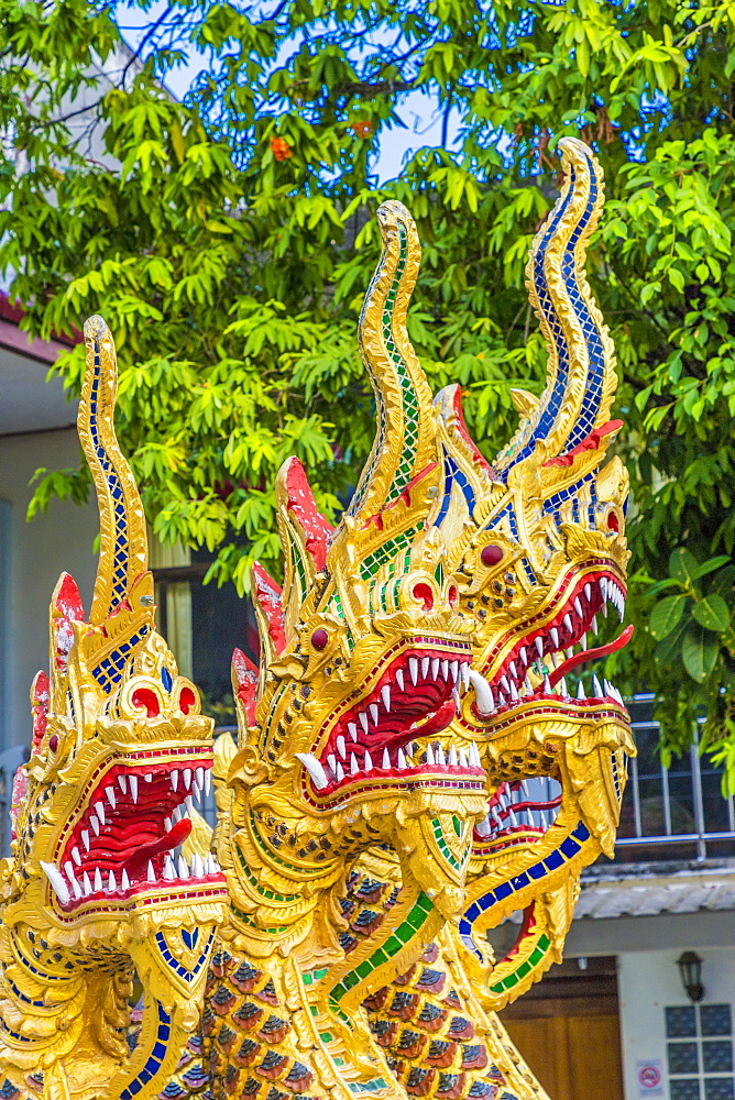 Serpentine dragons on a temple at the Office of National Buddhism, in Phuket Town, Phuket, Thailand, Southeast Asia, Asia