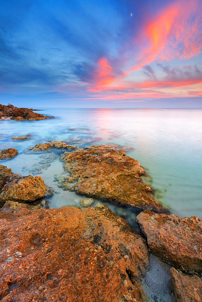 Rocks on the Salento coast at sunset, Dunes of Campomarino, Taranto province, Apulia, Italy, Europe