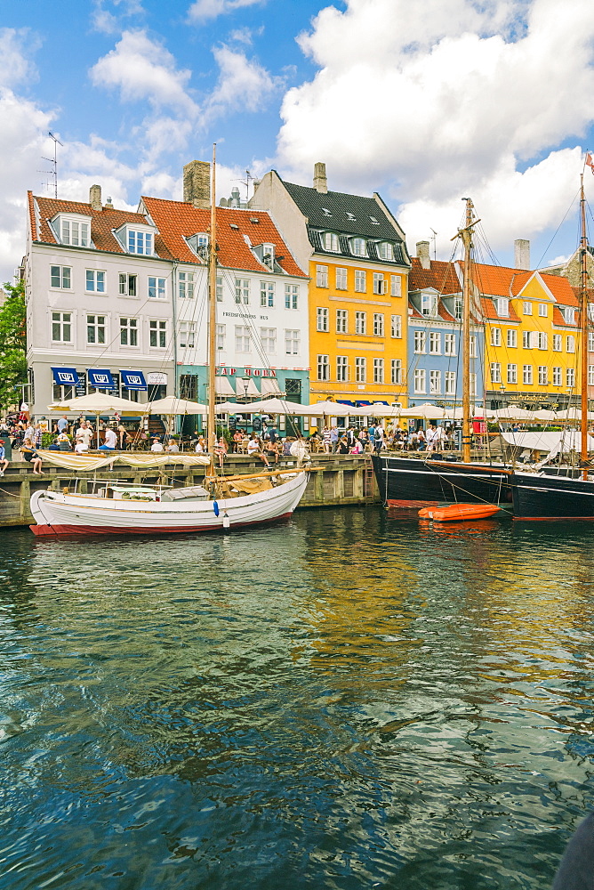 Nyhavn with old colourful buildings and boats anchored in summer, Copenhagen, Denmark, Europe