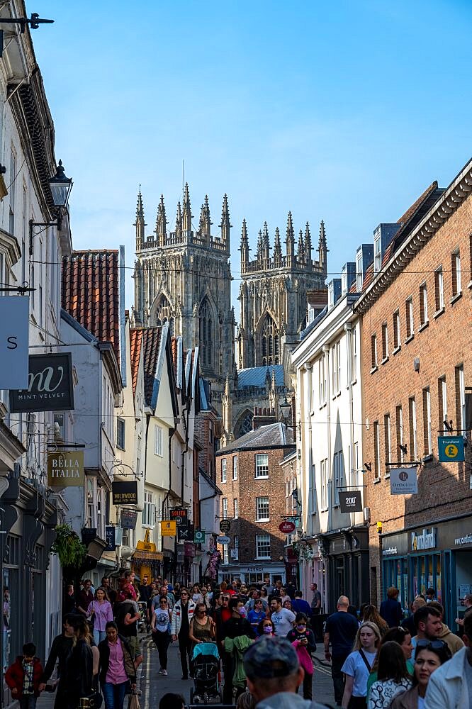 Tourists on street with view of York Minster, York, North Yorkshire