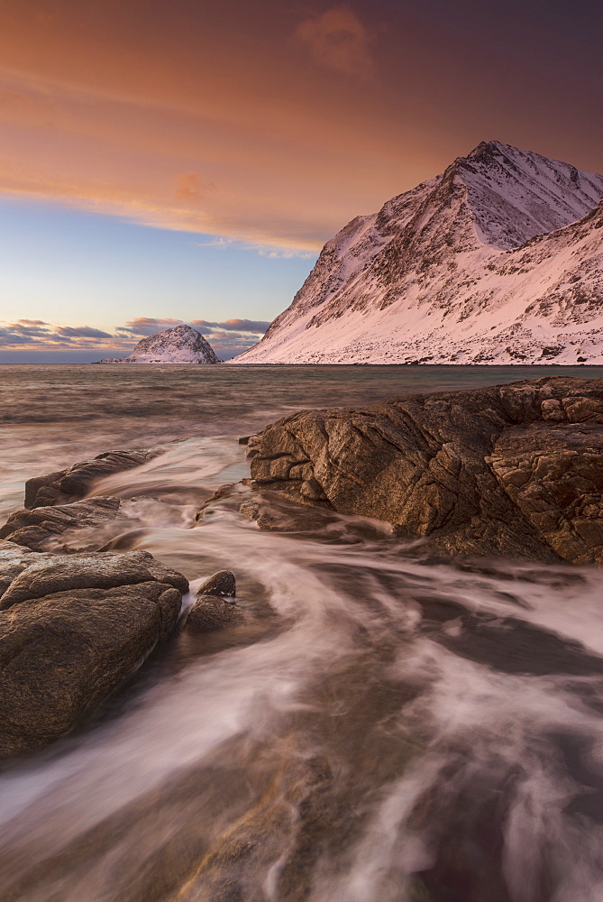 A dramatic sunset at Haukland Beach in winter, Lofoten, Nordland, Arctic, Norway, Europe