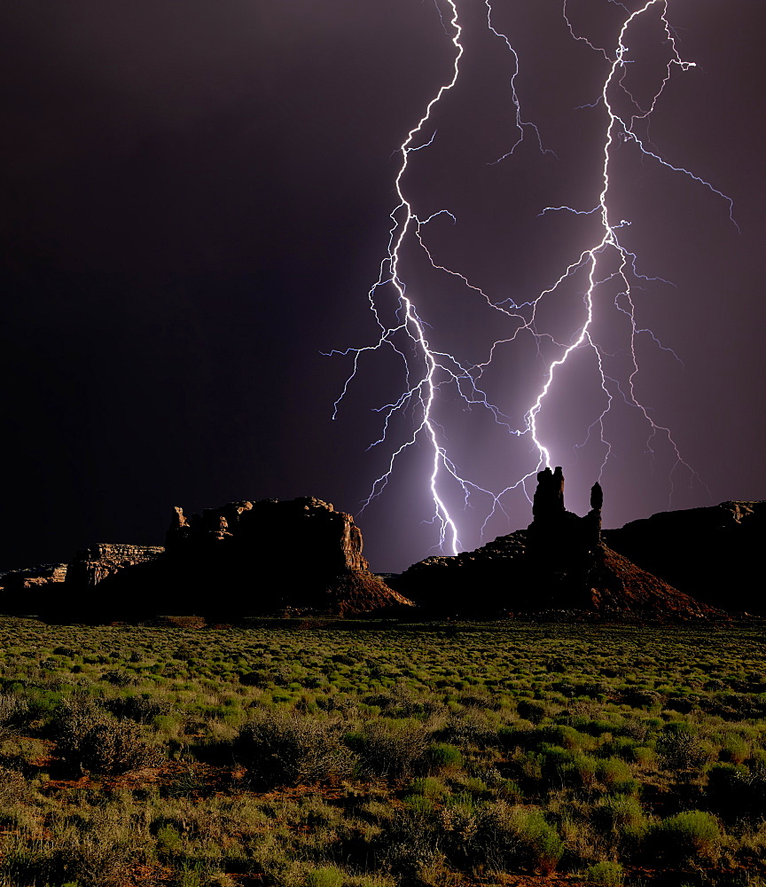 Composite photo of lightning striking Valley of the Gods in Utah, United States of America, North America