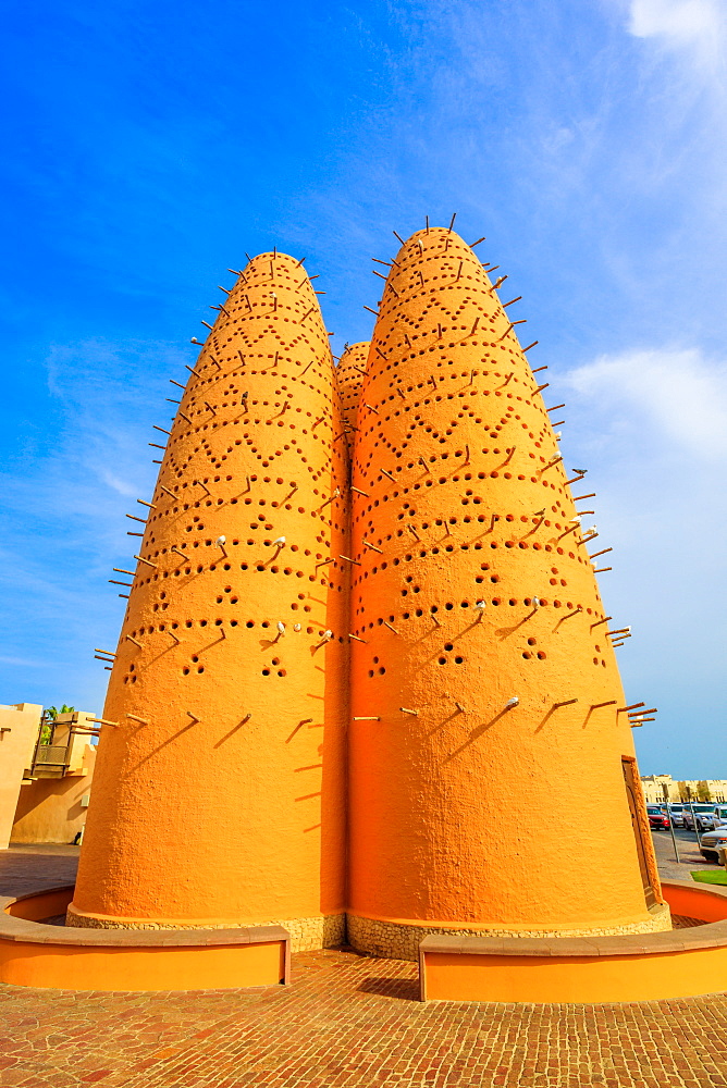 Pigeon towers and blue sky near Mosque in Katara, a cultural village (Valley of Cultures), West Bay, Doha, Qatar, Middle East