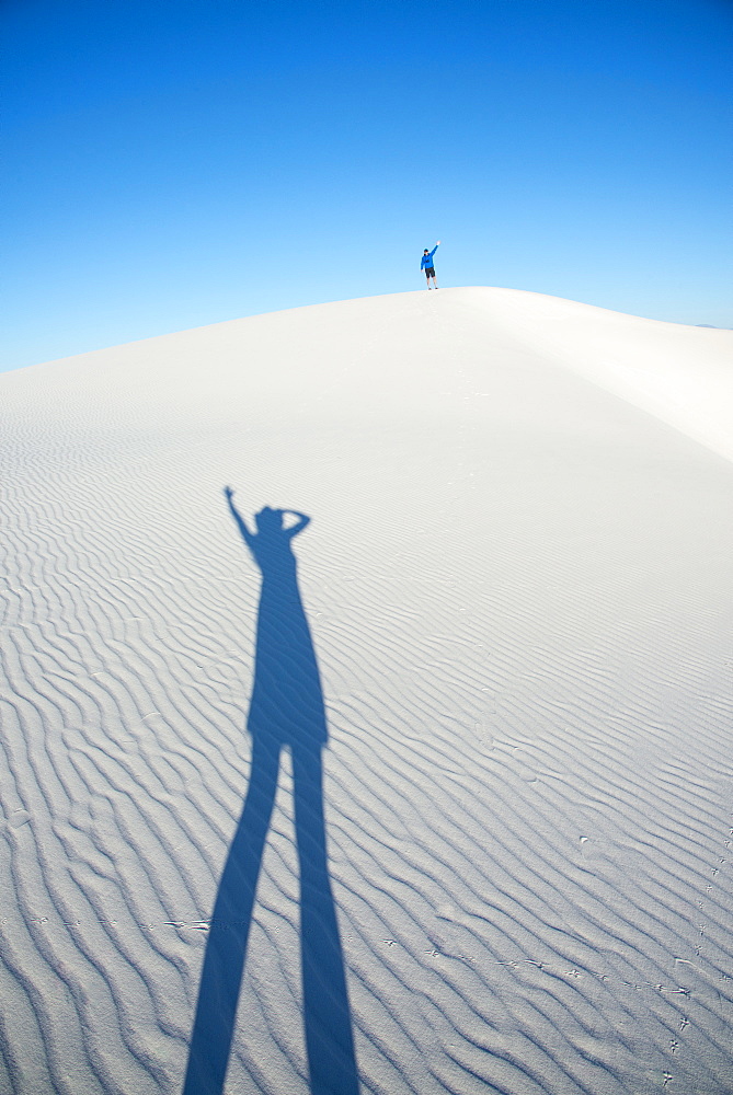 Two dorks playing with shadows in White Sands National Park, New Mexico, United States of America, North America