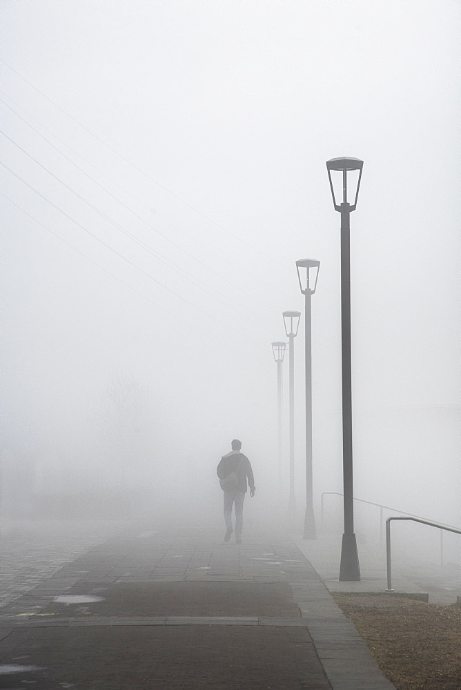 Walking in dense morning fog, French Quarter, New Orleans, Louisiana, United States of America, North America