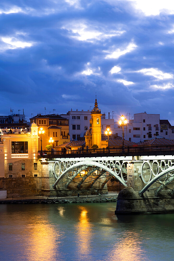 The Triana Bridge (Puente de Triana) (Puente de Isabelle II) at twilight, Seville, Andalucia Spain, Europe