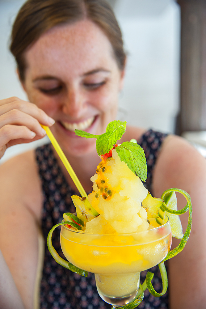 Tourist enjoying a cocktail in Old Havana, Havana, Cuba, West Indies, Caribbean, Central America