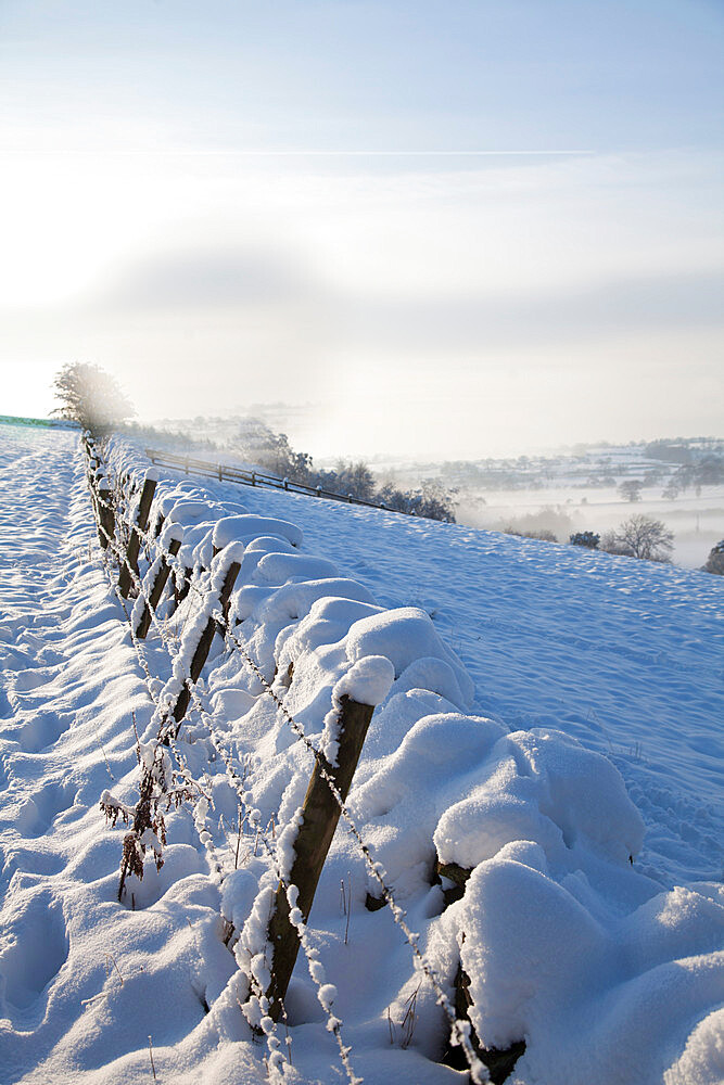 Snow covered dry stone wall, near Almscliff Crag, Wharfe Valley, North Yorkshire, England, United Kingdom, Europe