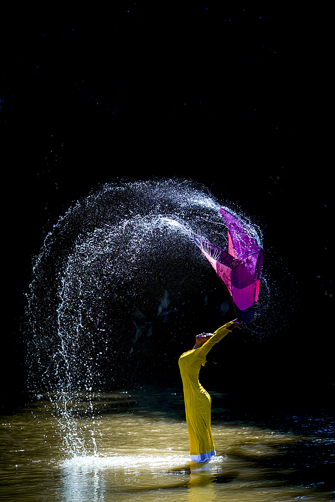 The girl washes her scarf and dances in the stream, Vietnam, Indochina, Southeast Asia, Asia