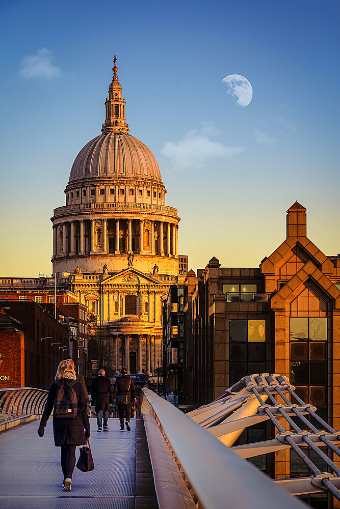 London commuters by St. Pauls Cathedral walking over Millennium Bridge, London, England, United Kingdom, Europe