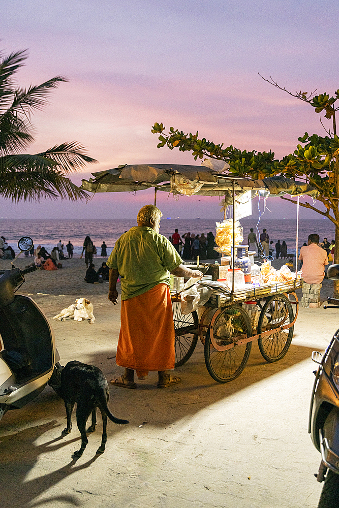 Street food vendor on the beach at sunset, Fort Kochi, Kerala, India